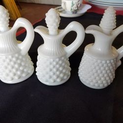 Vintage 3 milk glass hobnail cruets with glass stoppers 4.75 inches tall. A59V427