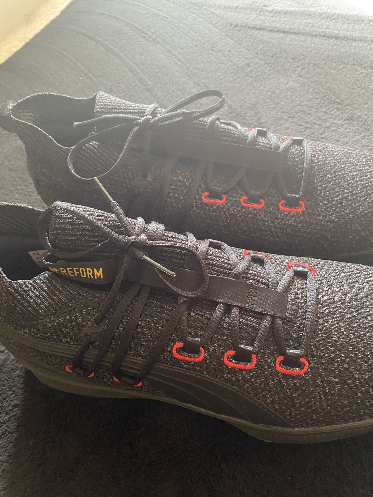 Puma Men's Clyde Court 'Reform' athletic sneakers in a black and red colorway,