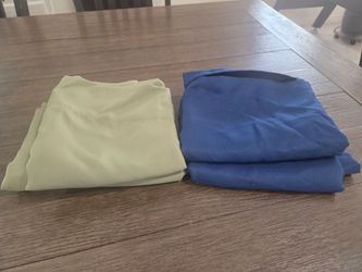 Window curtains including 4 individual panels, each measuring 27 inches wide by 63 inches long.