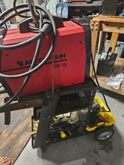 Mig welder 200. Like new.  Gloves helmet cart