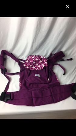 Ergo baby carrier with shade cover.