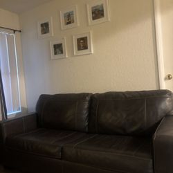 Gray Leather Sofa With White Stiching 