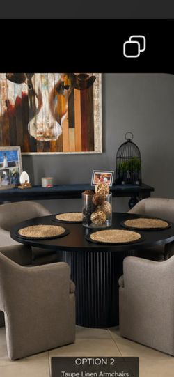 Black round pedestal dining table