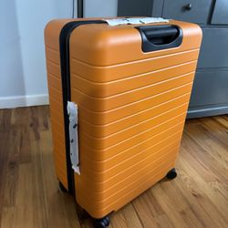 Away Suitcase The Large Flex Sorbet Orange