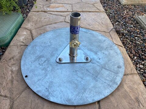 TUUCI UMBRELLA BASE . XL HEAVY UMBRELLA STAND 24 Width 90lbs . NEW START @ $950.oo $155.oo