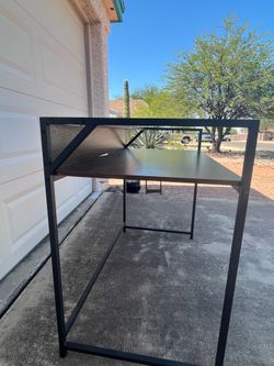 Desk for sell. Dark brown wood with black metal frame