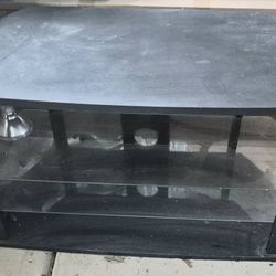 Stand
Sturdy black TV stand with glass shelves
