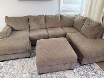 Sectional couch with reversible ottoman