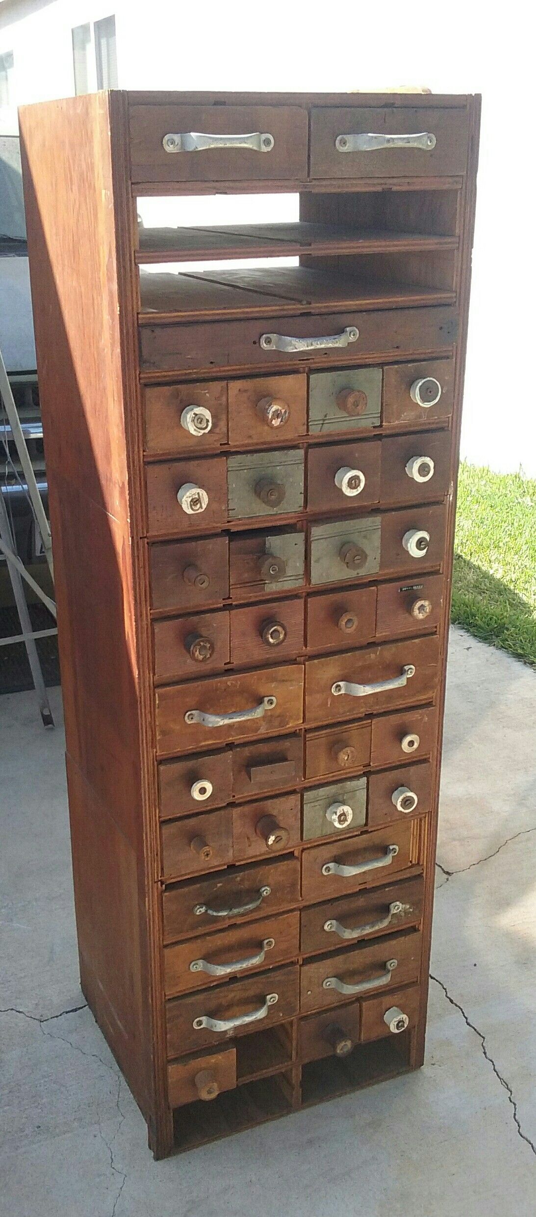 Primitive rustic wood cabinet with multiple drawers