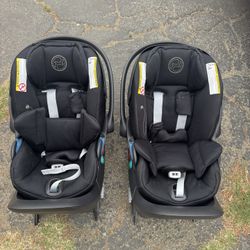 Black Cybex cloud G car seats with load base