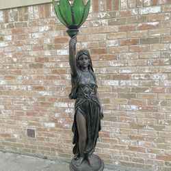 Lady Statue With Green Globe 