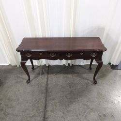 Traditional Dark Wood Console Table with Ornate Brass Hardware