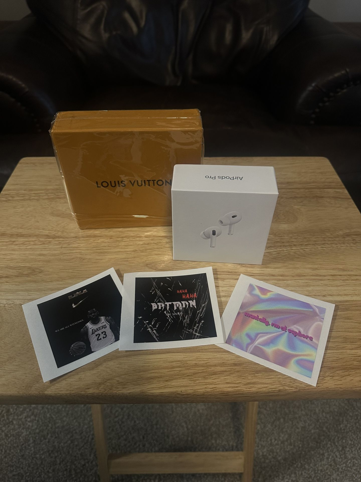 Custom Stickers, AirPods, And Louie Button Wallet