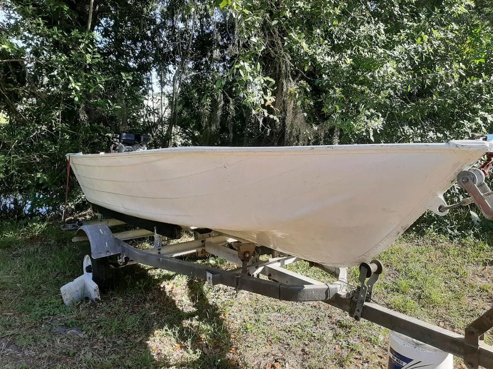 12 ft V Hull Jon Boat with a brand new SPS swamp Runner Mud Motor for