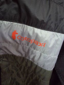 COTOPAXI XL WEATHER PROOF HOODED JACKET. USED TWICE LIKE NEW. TOO BIG FOR ME, PAID 175