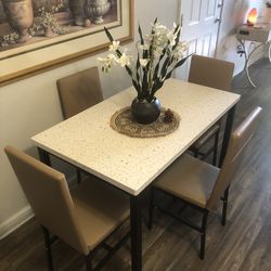 Like new white faux marble dining table set with 4 leather chairs
