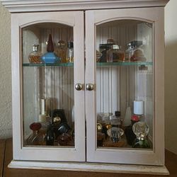 Small Cabinet Full of Full Perfume Mini Bottles