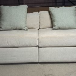Living Spaces 2 Piece Armless Modular Sofa.