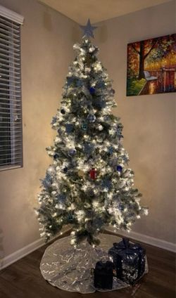 Beautiful white Christmas 🎄 tree with presents, stars etc and bag
