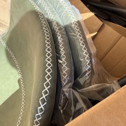 Green Barstools With White Stitching 