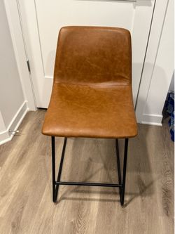 3 brown leather bar stools