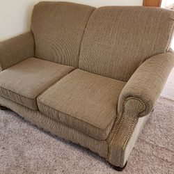 Set Of Two Tan Couches with Brass Tacks