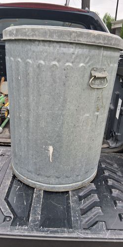 Metal garbage can. 3 plastic toys