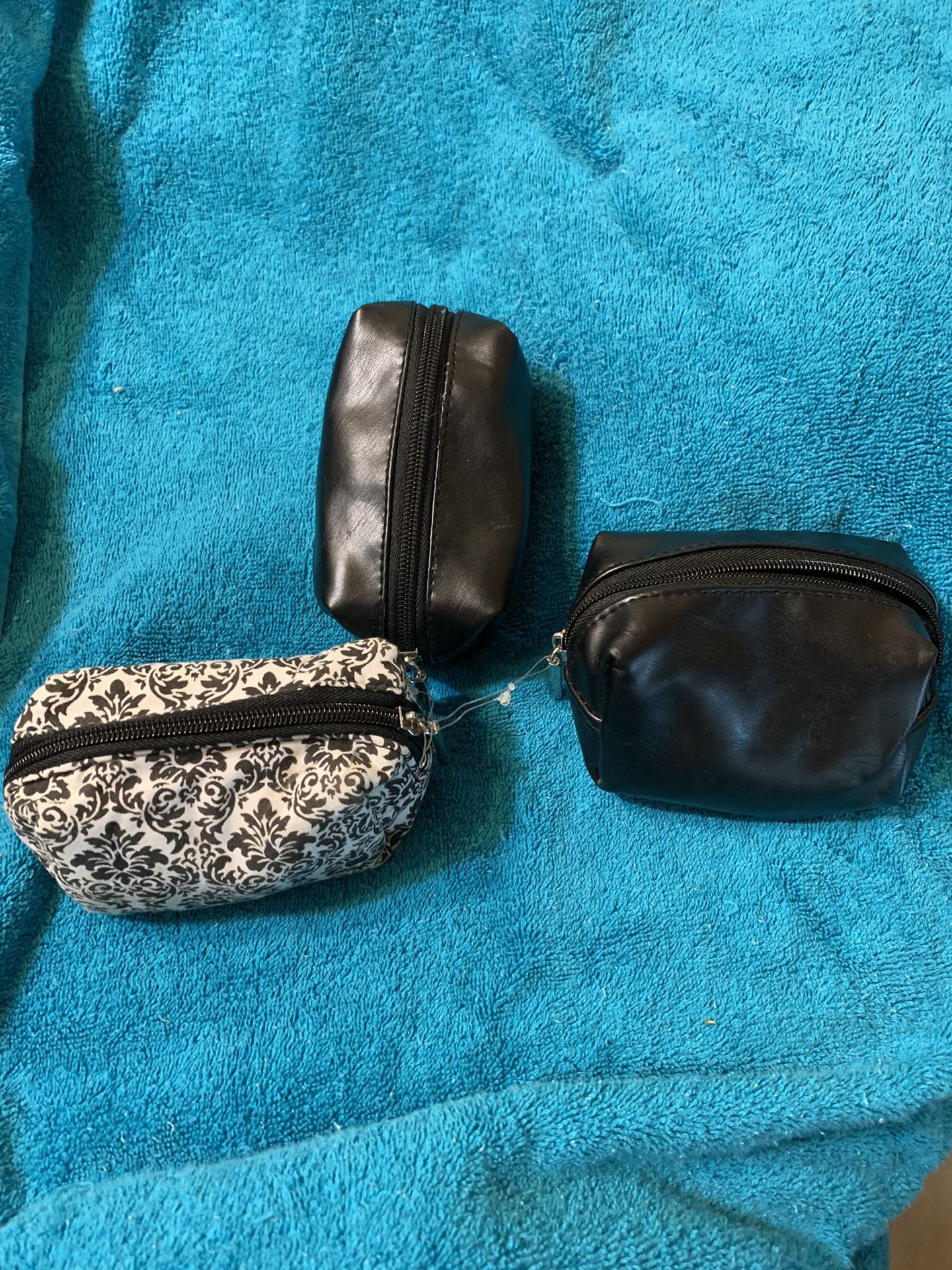 3 small makeup bags or change purses
