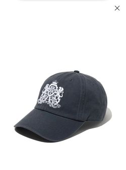 charcoal gray baseball cap featuring an embroidered white royal crest logo on the front crown, resembling designs like the King's Crown Hat by S.I.S.