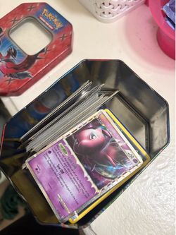 Pokémon tin with cards