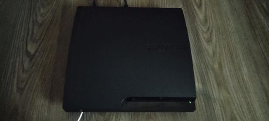 PlayStation 3 slim and 5 games