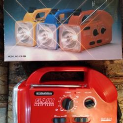 Vintage multipurpose radio/flashlight/alarm, new in box, red, works!!