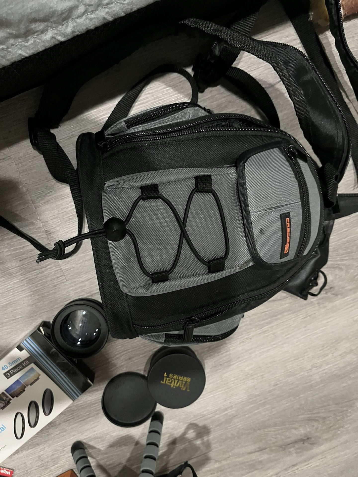 Camera backpack with equipment lenses tripod and more