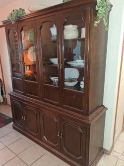 Three piece dining set. Table, with two leafs, chairs, buffet,  display cabinet.