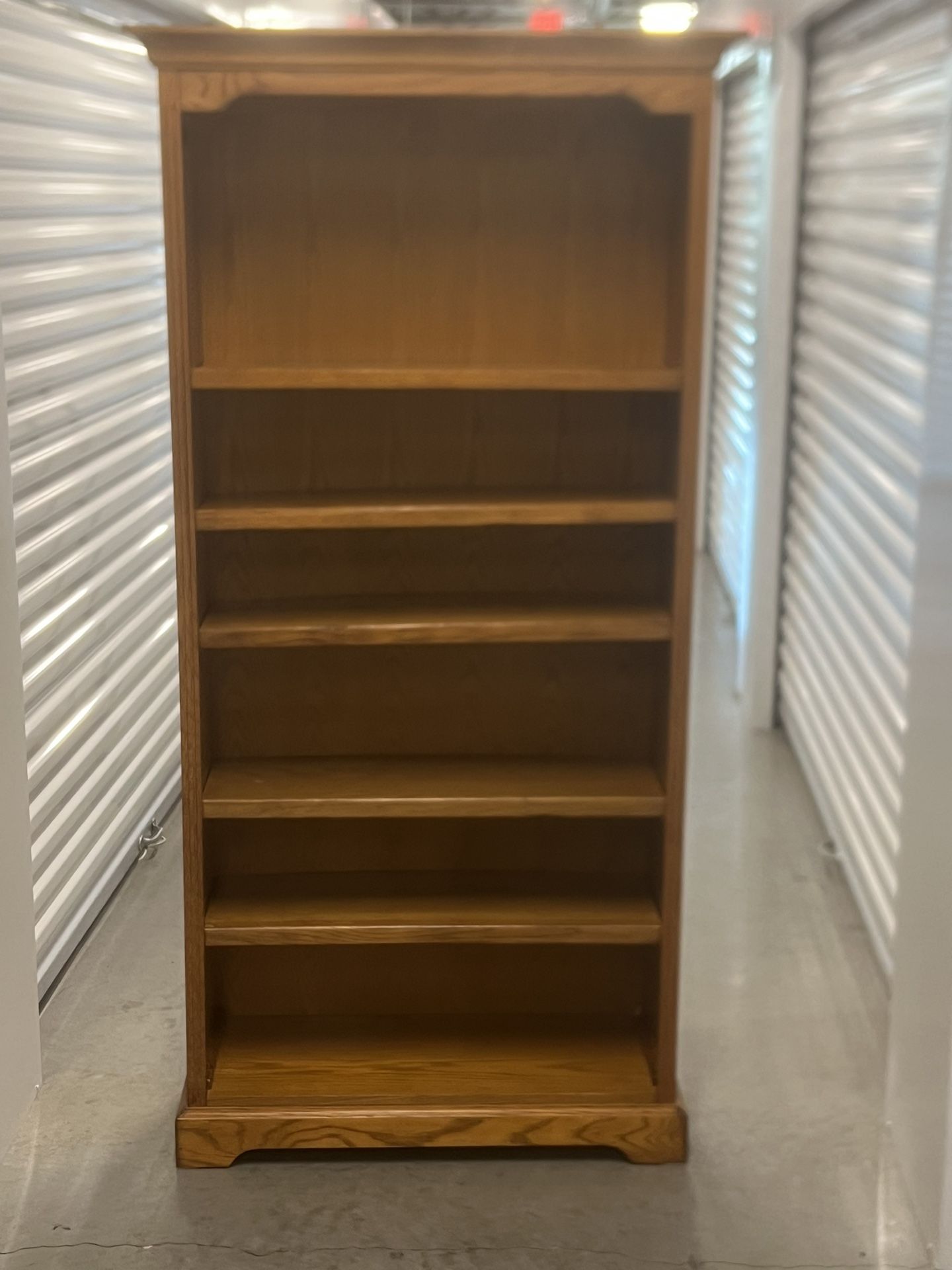 Grand oak 6 ft solid wood adjustable bookcase in great condition.  31705 Wesley Chapel blvd Fl 33543 Storage Mart  