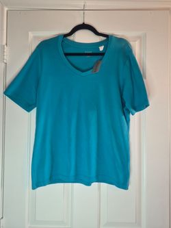 Blusa azul de mujer, marca Chico's, 98% algodón y 2% spandex.