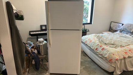 Refrigerator with ice cube maker.