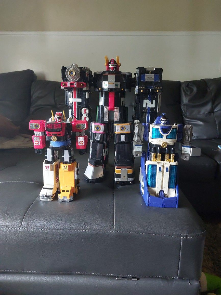 (From Left To Right) Power Rangers Lightspeed Megazord, Supertrain Megazord And Max Shuttle Megazord