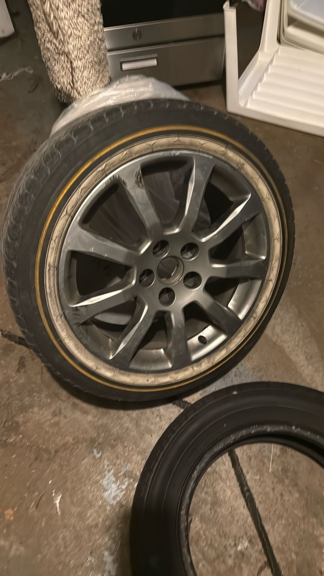 One Cadillac Rim And Tire. 