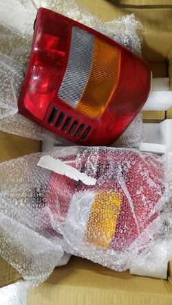 1999 Jeep grand cherokee oem tail lights.
