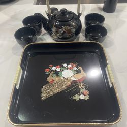 Vintage Japanese teapot set featuring a peacock and floral design