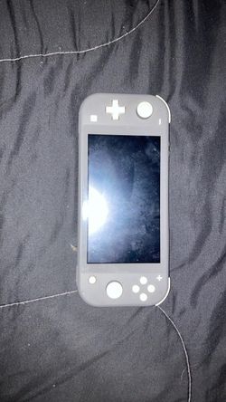 Used Nintendo switch lite grey (broken charger port)