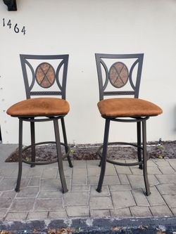 Two bar height swivel top chairs seat cushion 30 inches high
Top of the back of the chair is 46 inches