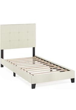Twin upholstered beige bed