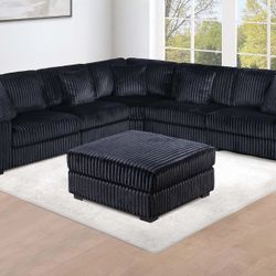 LARGE MODULAR SECTIONAL WITH OTTOMAN. BLACK FUR LIKE CORDUROY 