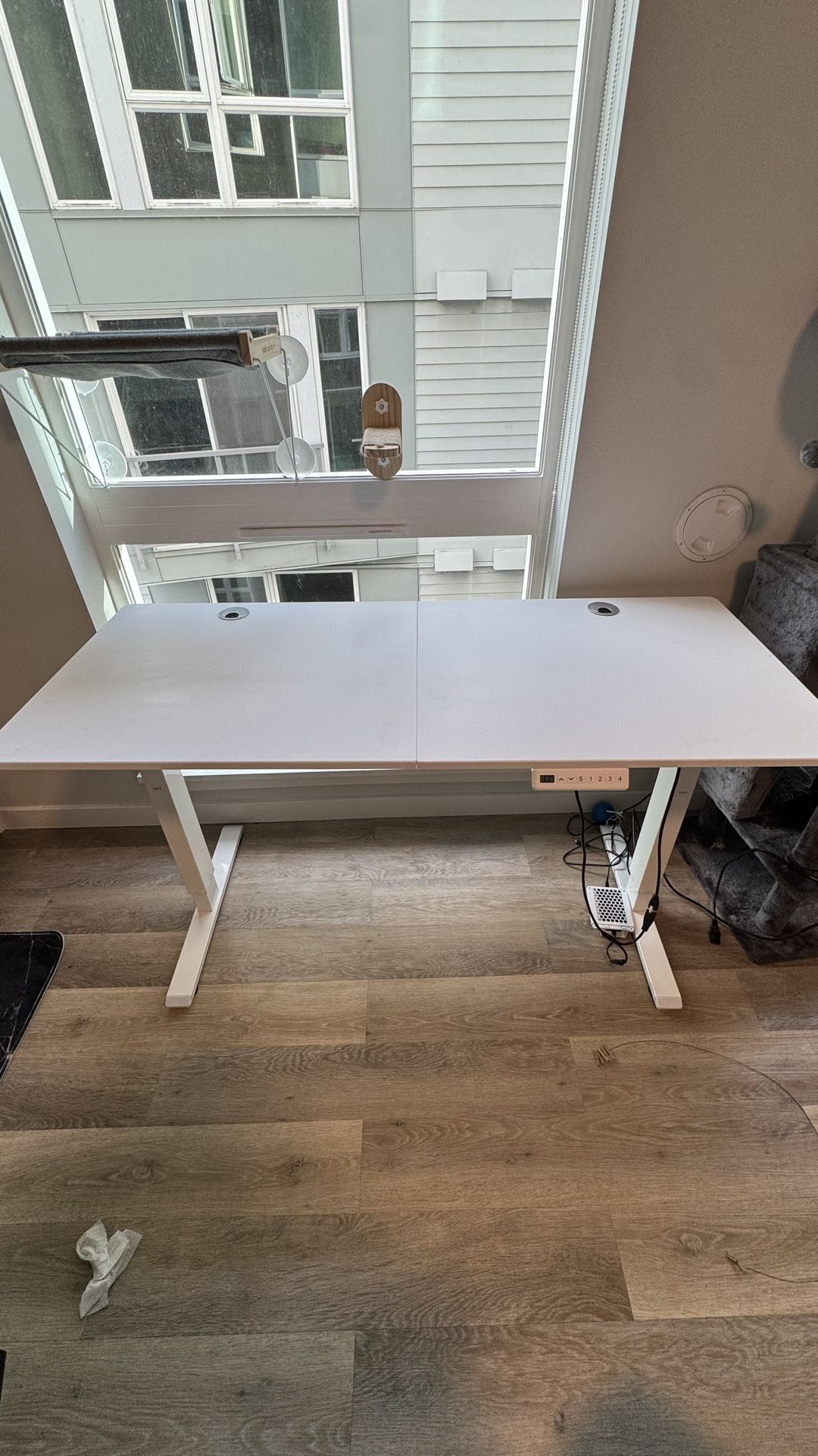 55” Adjustable standing desk and large boucle chair