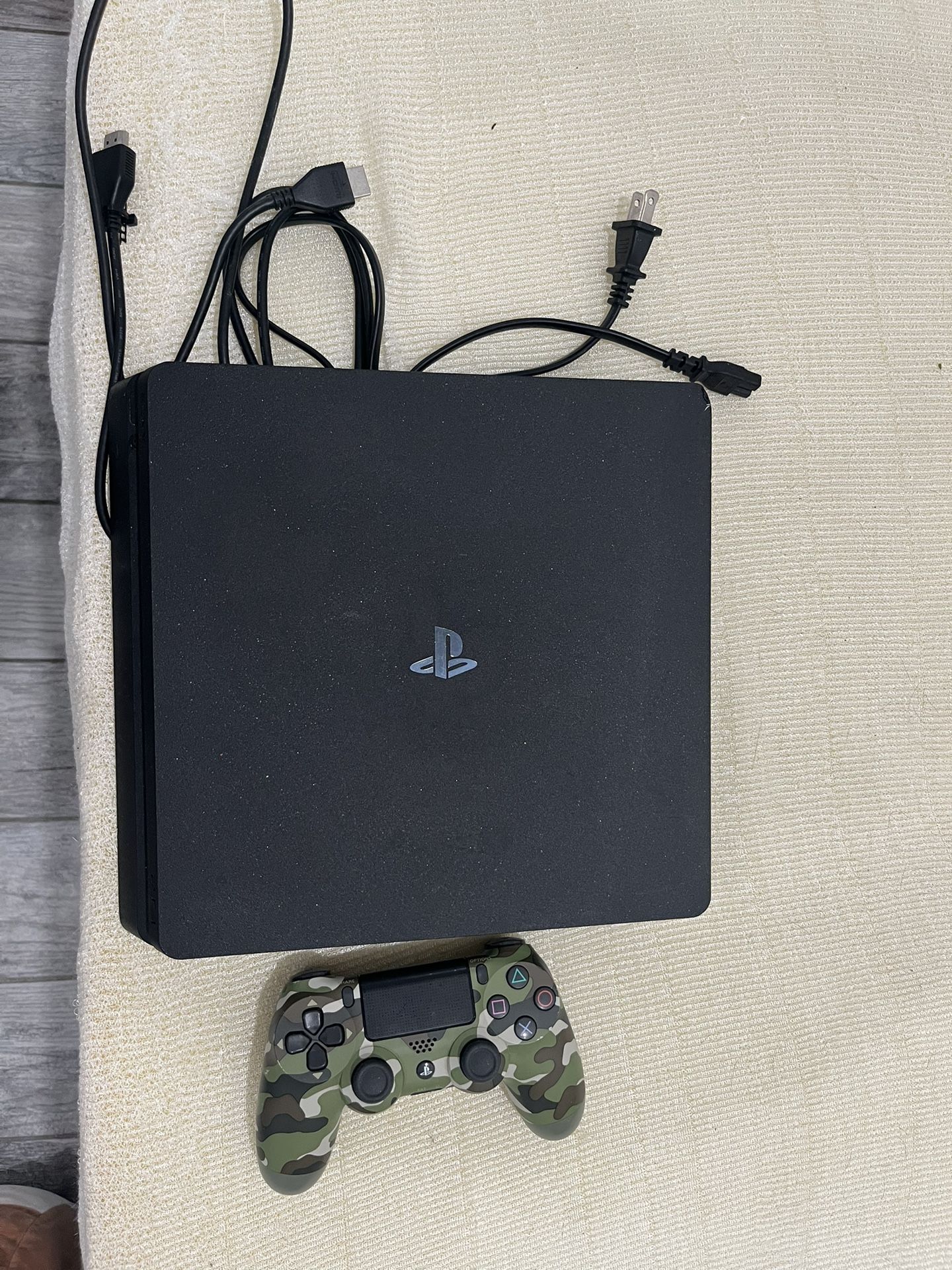 PlayStation 4 Slim – 1TB with Camo Controller & Cables