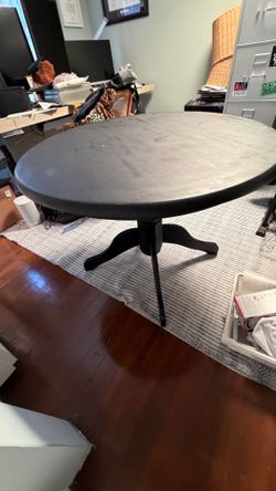 Black pedestal table