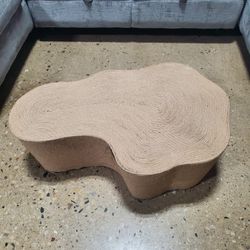 Coffee Table, a handcrafted piece known for its unique, irregular shape. (New)