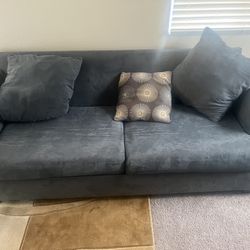 1 love seat and couch with fold out bed and ottoman